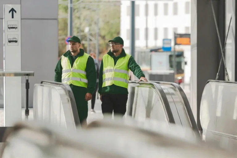 Security operators by escalators [city]