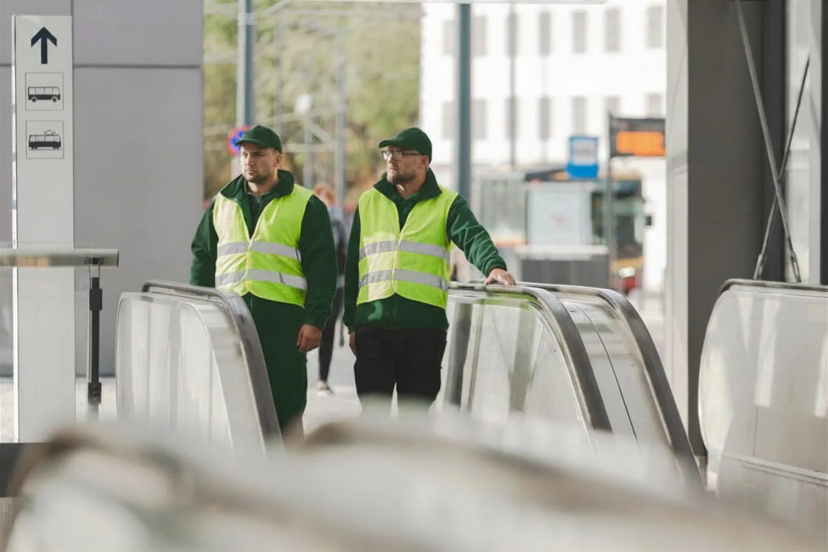 Security operators by escalators [city]